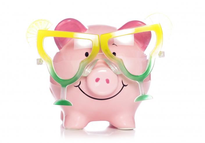 pink piggy bank with new year's glasses representing new year's financial resolutions