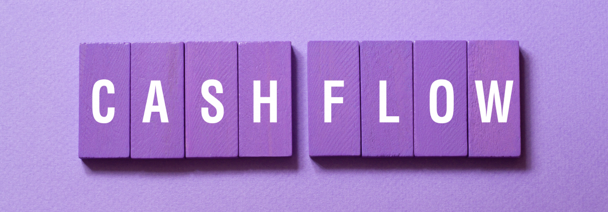 purple blocks with white letters spelling "cash flow" on a lighter purple background